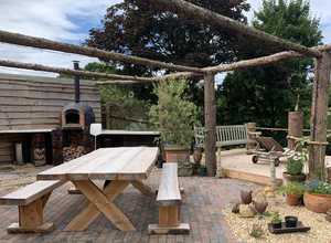 Outdoor barbecue area with terracotta pots